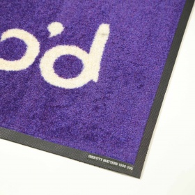 Corner product image of PrintPlush Logo Mat made from Plush nylon carpet top with nitrile rubber backing