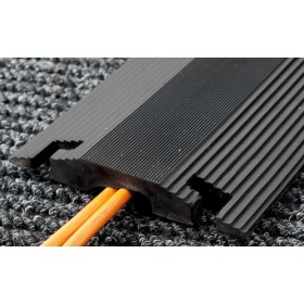 Insitu image of the Cord-Cover Designed specifically for hard floors to protect electrical and data cables on hard floors and reducte trip hazards.