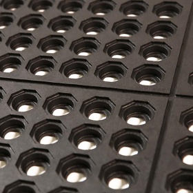 Close up product image of the Interlocking Anti-fatigue mat with drainage holes