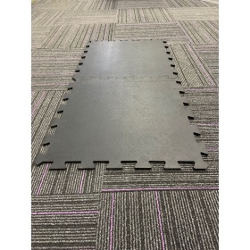 Product image of two interconnecting gym mat tiles slotted together 