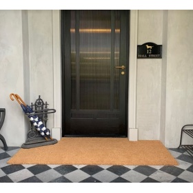 Insitu image of a coir mat in a protected outdoor entrance.