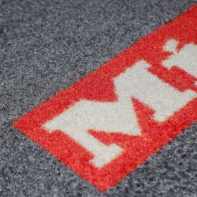 Close up image of a PrintPlush mat with fully customisable colour options for branding,