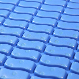 Close up image of the blue S-Mat rubber and plastic composition which is oil resistant.