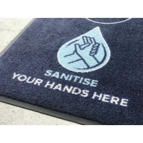 Encouraging customers to sanitise their hands. Absorbing moisture from sanitising station spills and footwear.