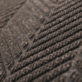 Super close up of the Waterhog Eo Eli Mat with unique diagonal stripe design in charcoal.