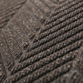 Super close up of the Waterhog Eo Eli Mat with unique diagonal stripe design in charcoal.