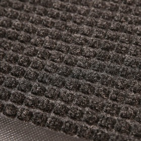Close up product image of charcoal, polypropylene Waterhog Classic Mat made for commercial and residential entrances.